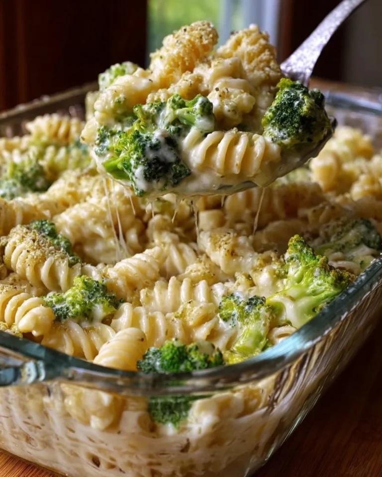 No-Boil Broccoli Pasta Bake in a baking dish, topped with cheese and herbs.