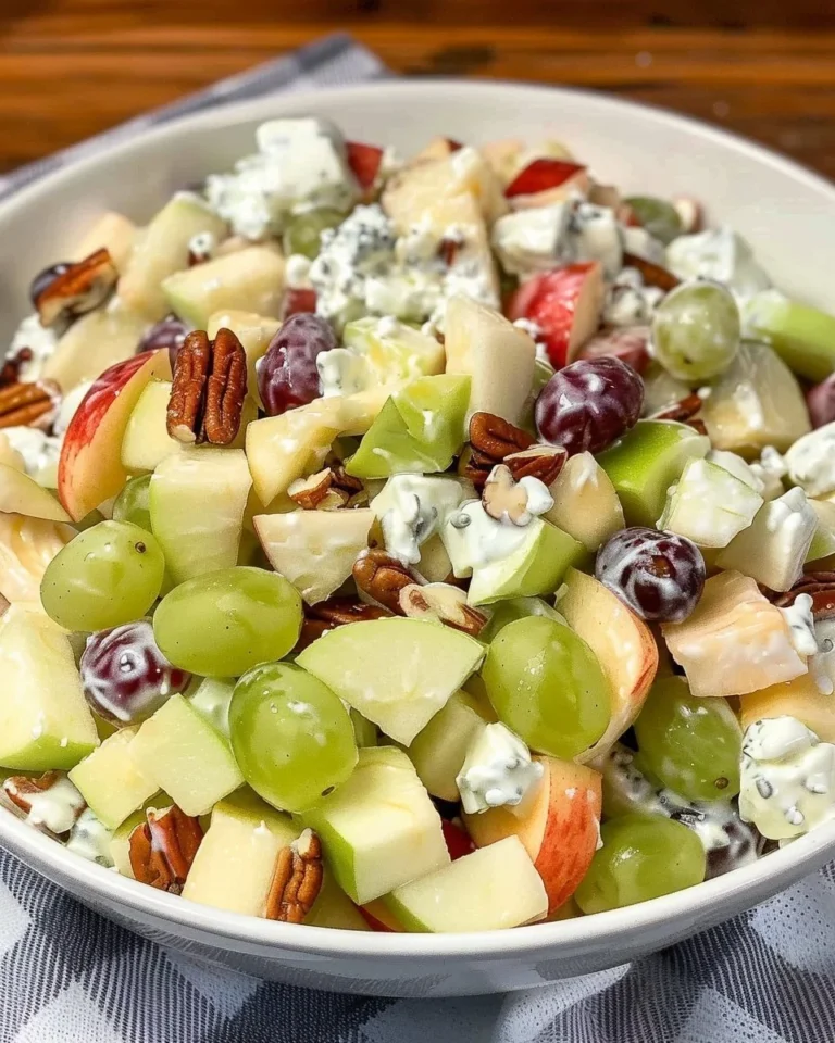 Delicious fruit salad topped with sour cream dressing for a refreshing dessert