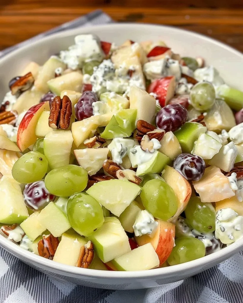 Delicious fruit salad topped with sour cream dressing for a refreshing dessert