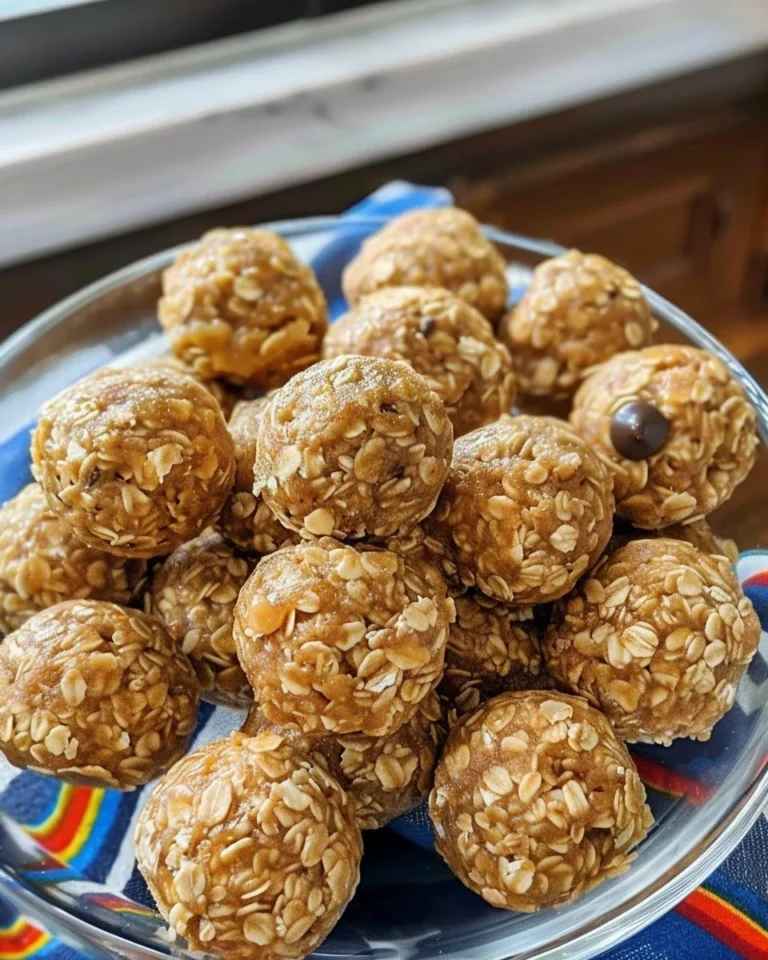 A plate of homemade Peanut Butter Balls rolled in oats and chocolate.